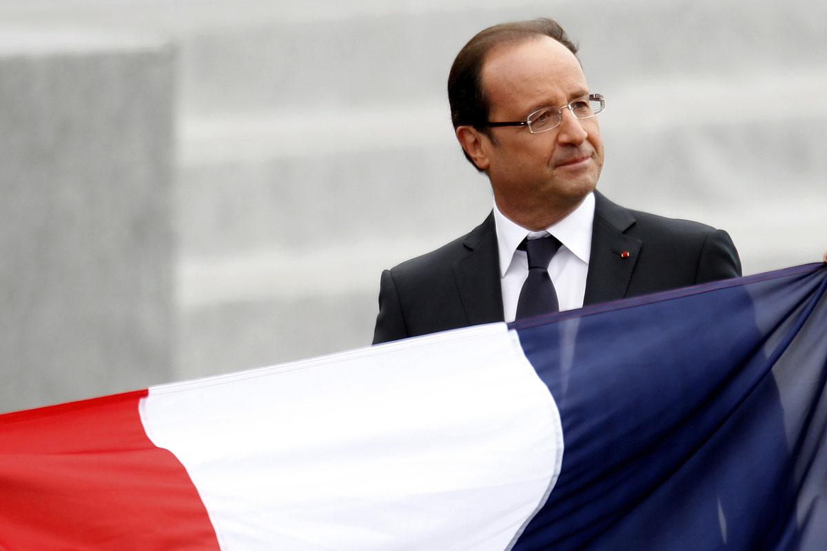 France's President Francois Hollande leaves after the traditional Bastille Day military parade in Paris