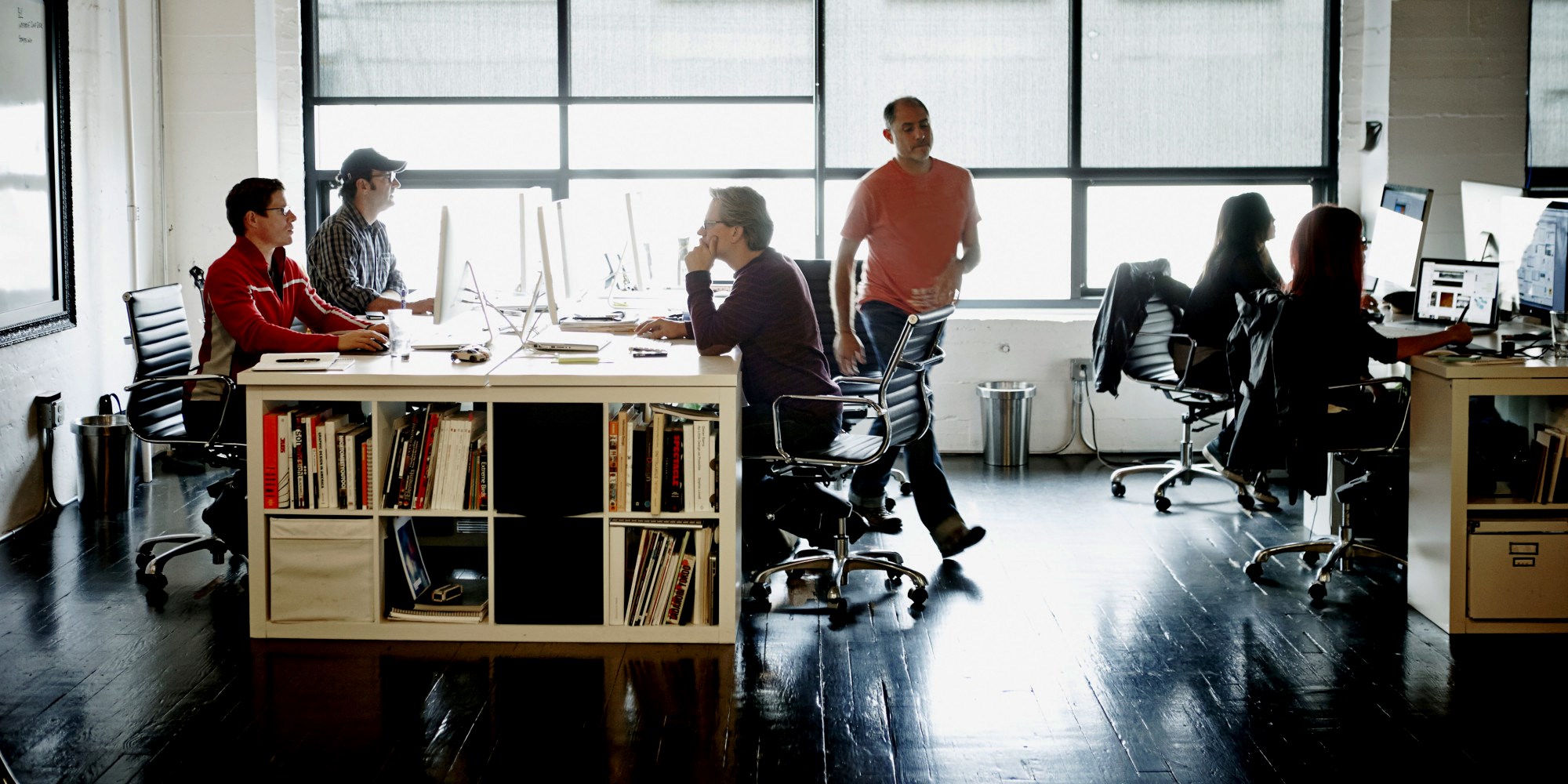 Coworkers at workstations in high tech office